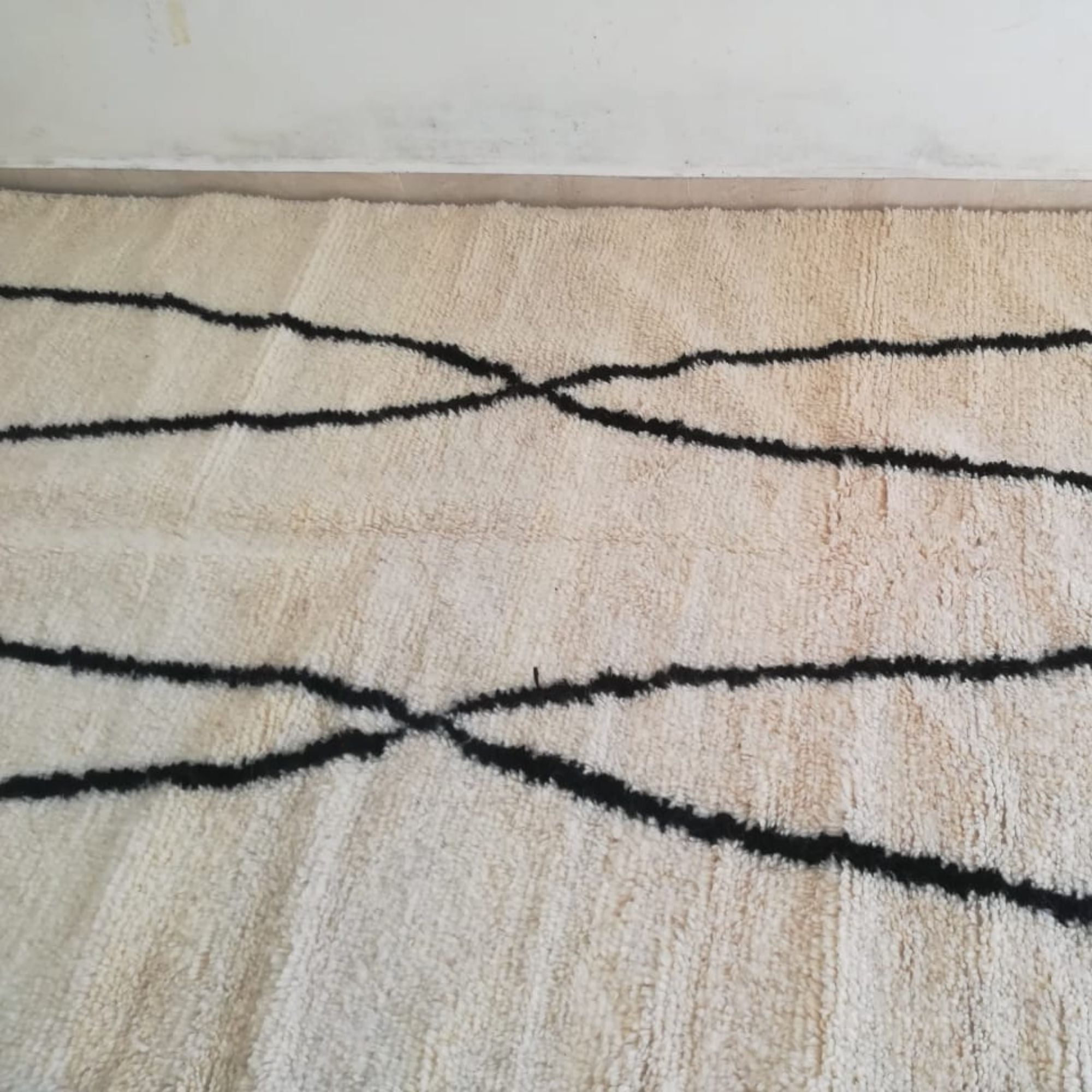Ivory Beni Ourain Rug - Black Curved Line Design - Hand-knotted Moroccan rug, front view showing Ivory Beni Ourain Rug - Black Curved Line Design texture and colors