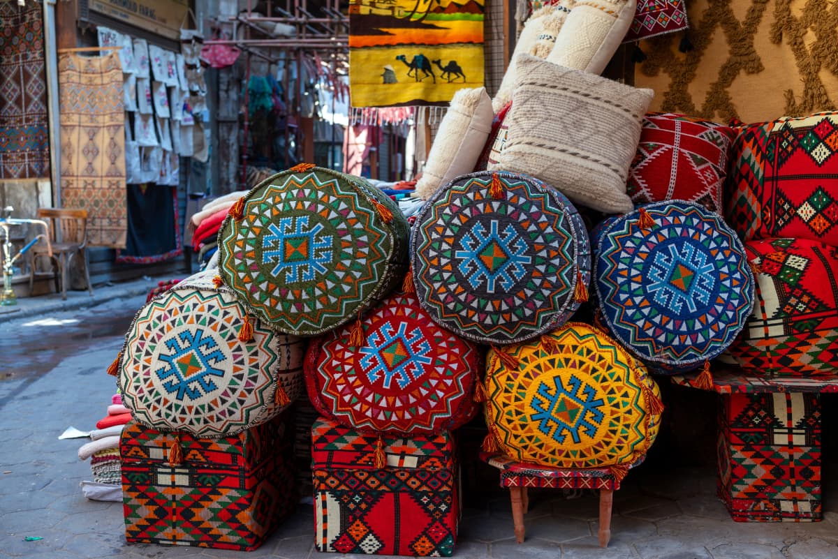 Tattoos on Skin, Tattoos on Wool: The Sacred Geometry of the Amazigh Matriarch